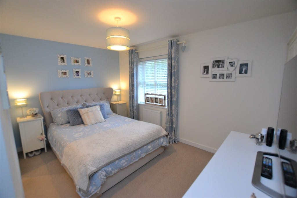 8 Tips to Sell Your Home Quickly blue double bedroom