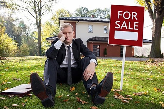 The Top Costly Mistakes to Avoid When Selling Your Home Graphic to show Worried real estate agent and house for sale